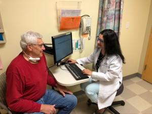 Doctor with patient in clinic